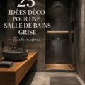 Salle de bains moderne avec des murs gris et accessoires élégants.