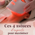 Femme utilisant un masque LED pour le soin de la peau, lumière rouge activée, ambiance cosy